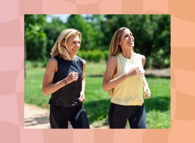 two fit, happy middle-aged woman walking outdoors on a sunny day