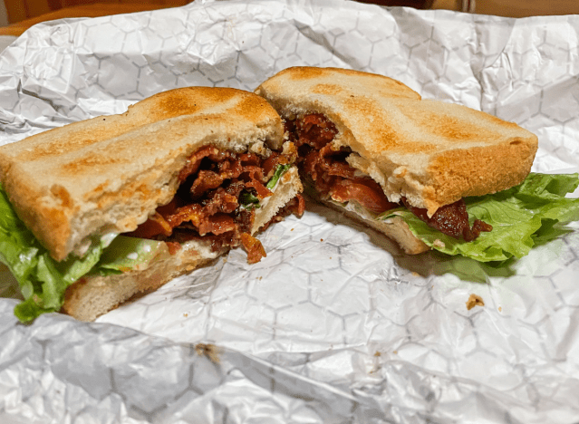 a blt from friendly's cut in half on a wrapper 