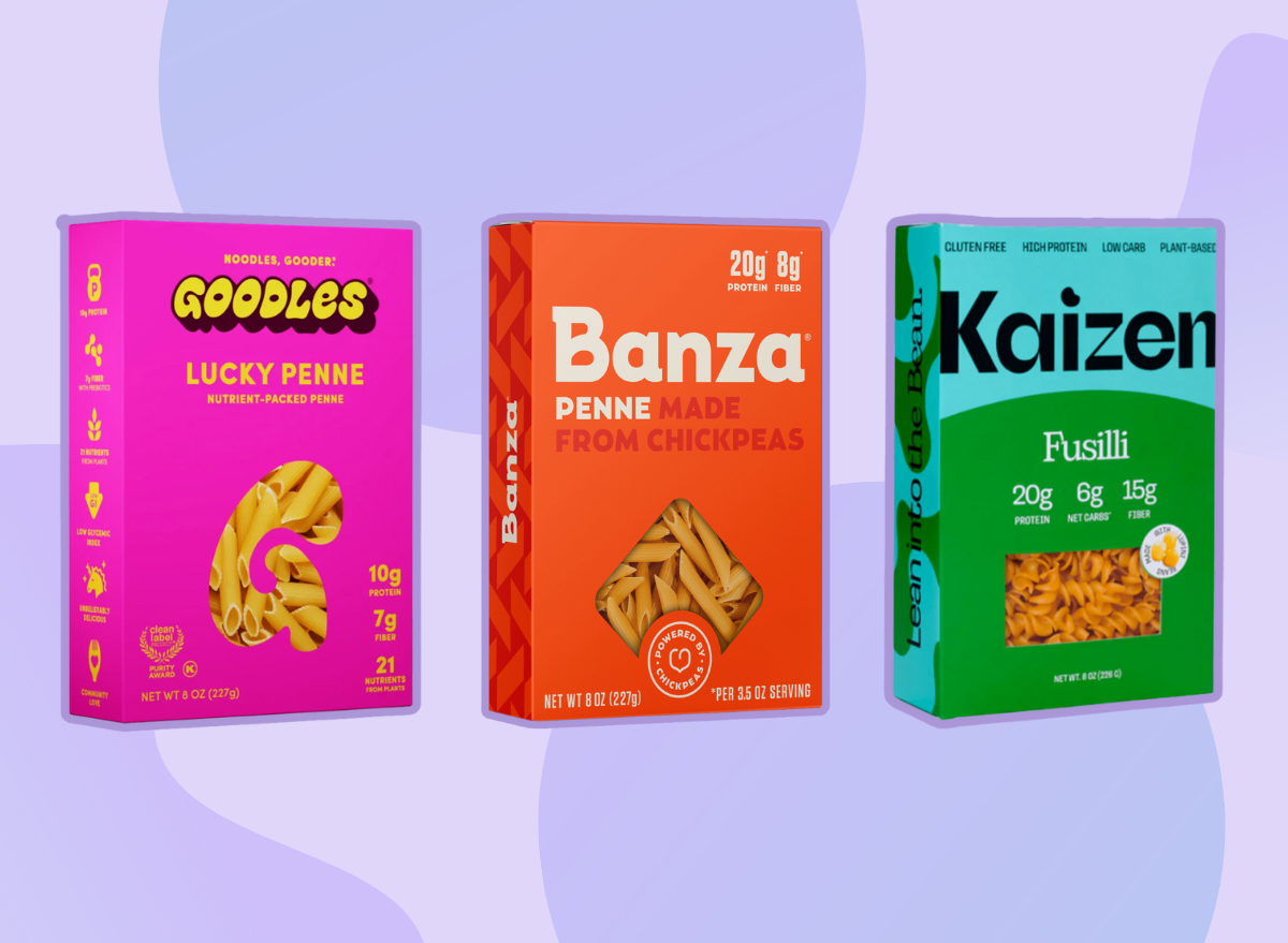 three boxes of high fiber pasta brands on purple background