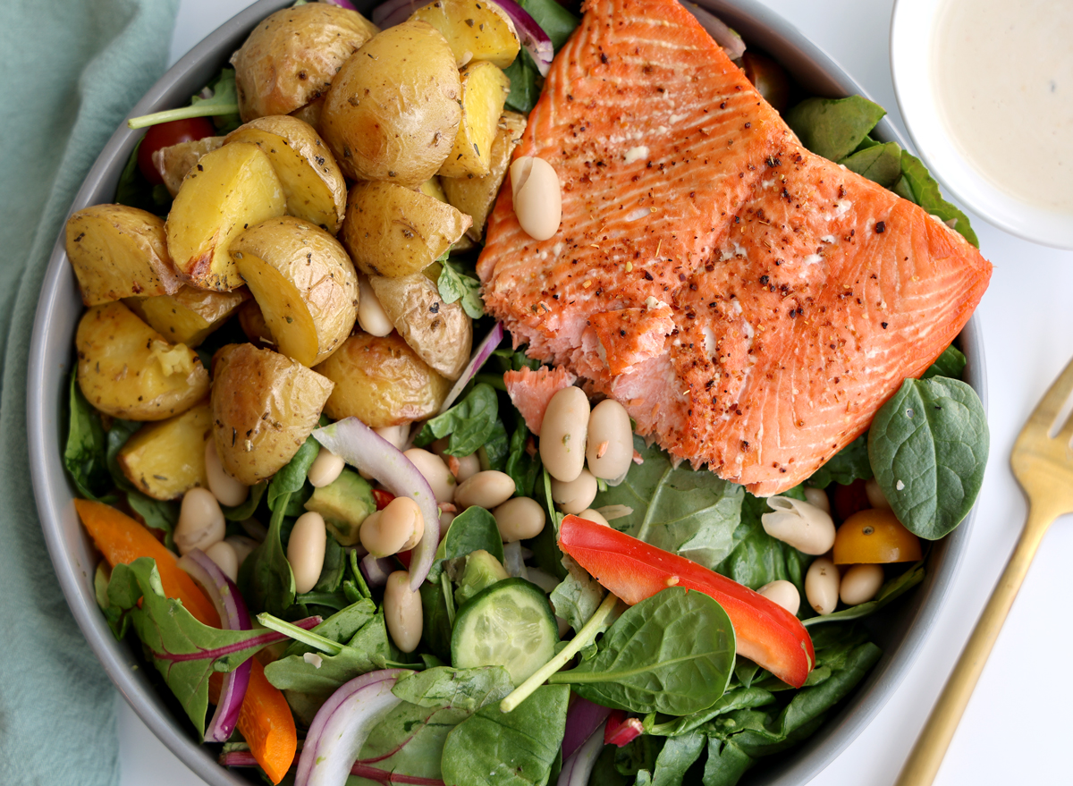 high protein salmon potato bean salad with creamy lemon dressing overhead view