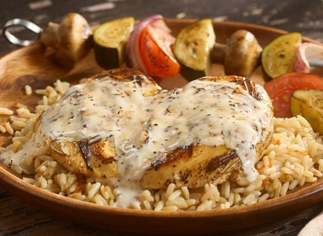 logan's wood grilled chicken over rice with vegetables