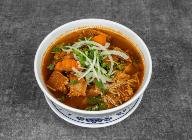 mama hong beef stew in a printed bowl on a gray background