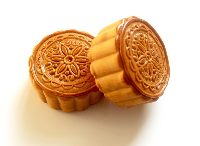 Traditional Chinese mooncakes on a white background.