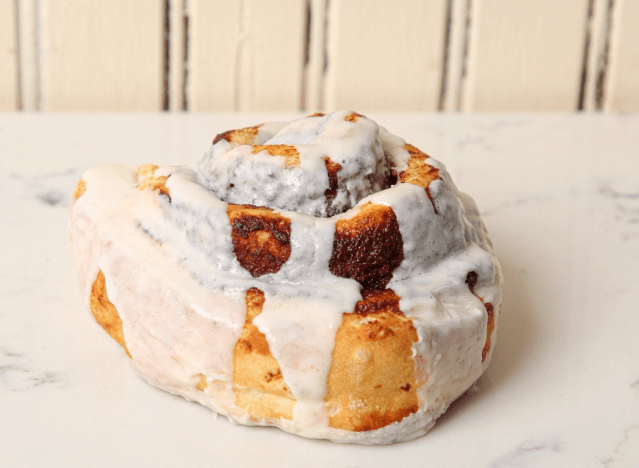 pj's coffee cinnamon roll on a marble counter