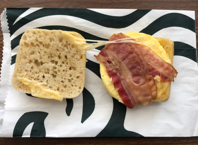 an open faced breakfast sandwich from starbucks on a wrapper 