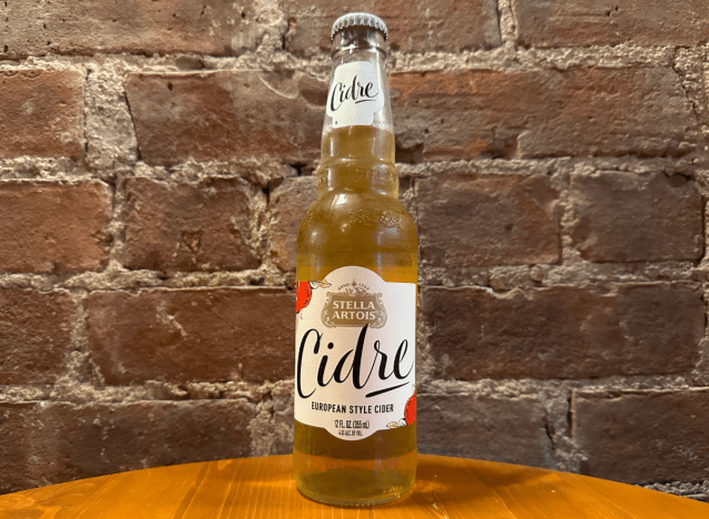 a bottle of stella cidre on a table 