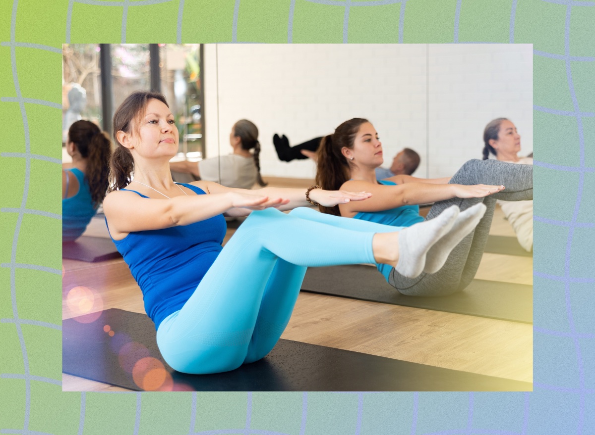 middle-aged woman doing core exercise in workout class