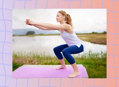 fit woman doing squats on yoga mat near lake