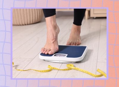 close-up of woman's feet stepping onto scale