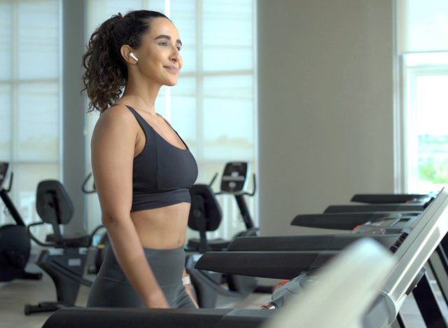 woman doing treadmill walking at the gym