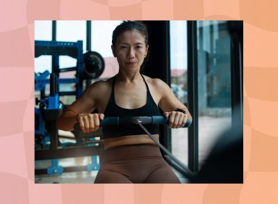 fit woman using rowing machine at the gym