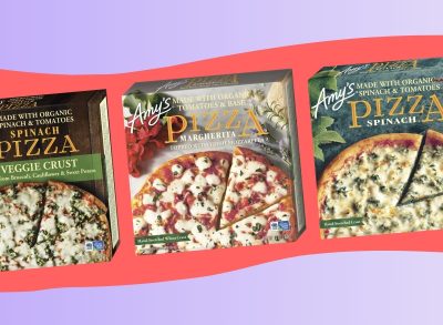 A trio of Amy's brand frozen pizzas set against a colorful background.