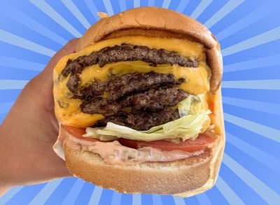 The 4x4 burger from In-N-Out set against a vibrant background.