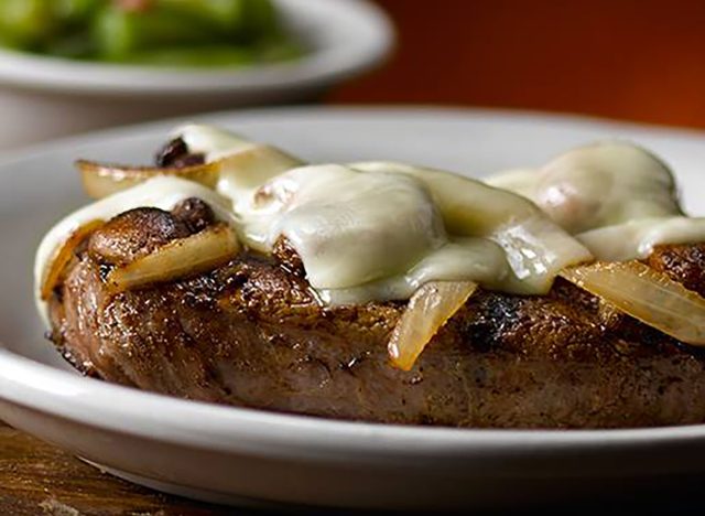 Steak smothered in cheese, onions, and mushrooms at Texas Roadhouse