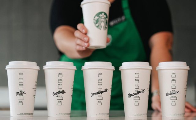 Starbucks cups labeled with names of alternative milks