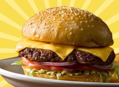 The All-American Cheeseburger at Texas Roadhouse set against a vibrant background