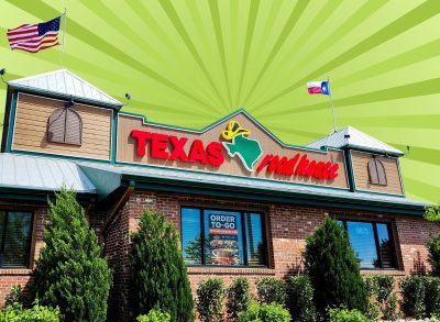 The storefront of a Texas Roadhouse restaurant set against a vibrant background