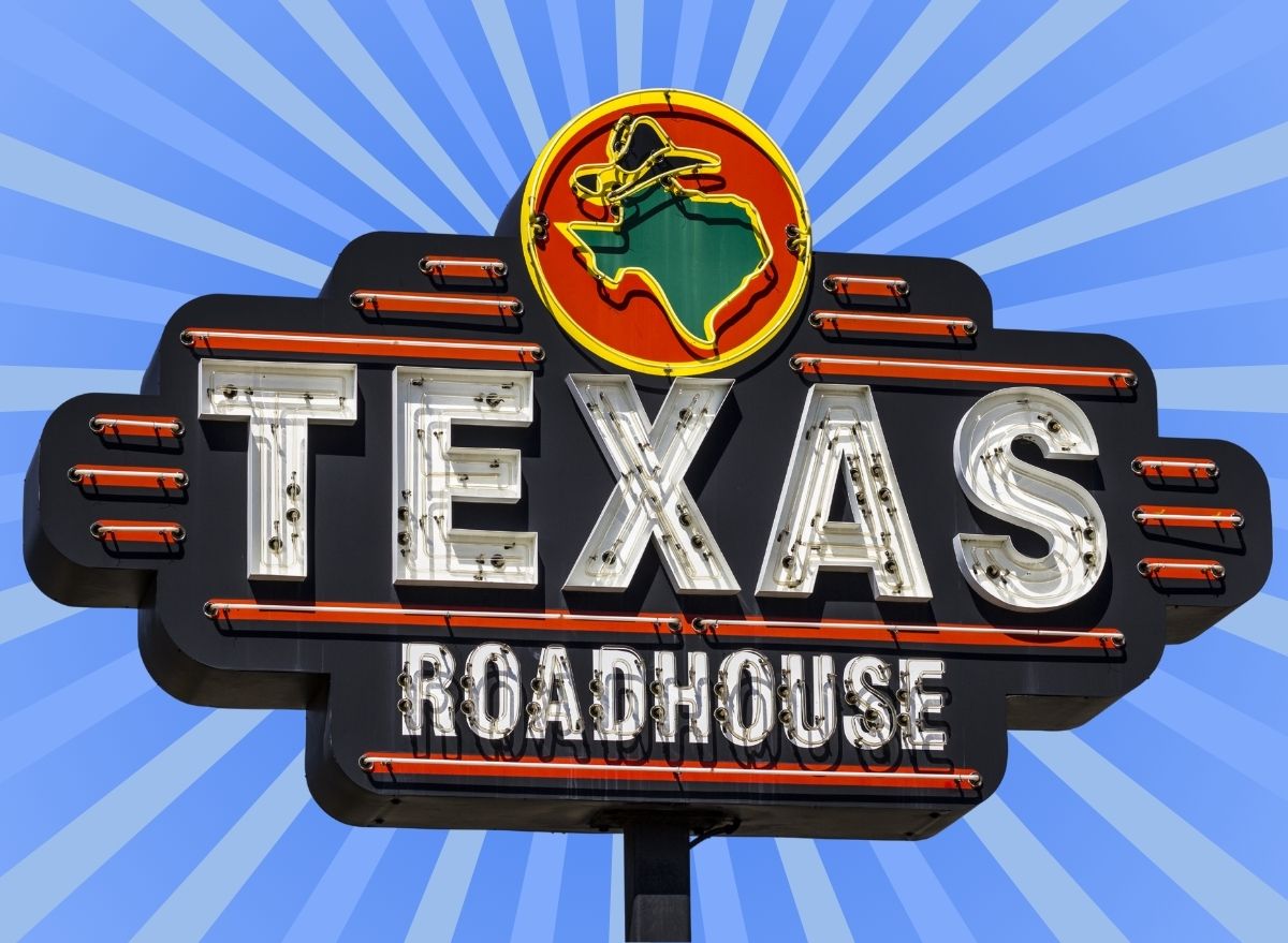 The sign for popular steakhouse chain Texas Roadhouse set against a colorful background.