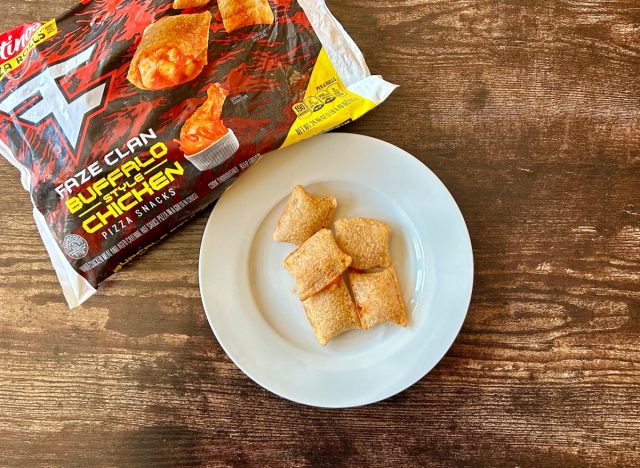 Totino's Faze Clain Buffalo Style Chicken Pizza Rolls on a plate next to a box of the product