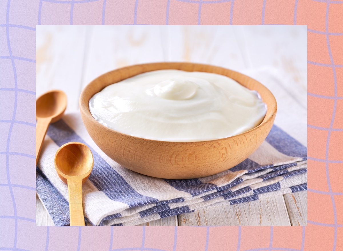 Greek yogurt bowl on striped hand towel