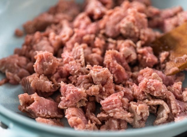 Browning ground turkey on a nonstick frying pan