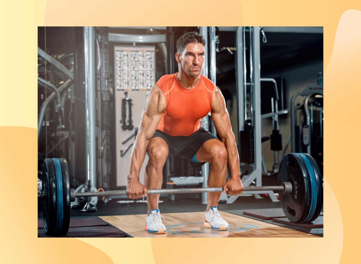 fit, muscular man doing barbell deadlift exercise