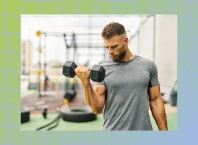 fit, muscular man doing bicep curls at an outdoor gym