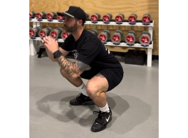 lowering into squat