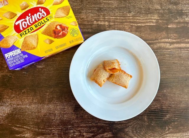 Totino's Pepperoni Pizza Rolls on a plate next to a box of the product