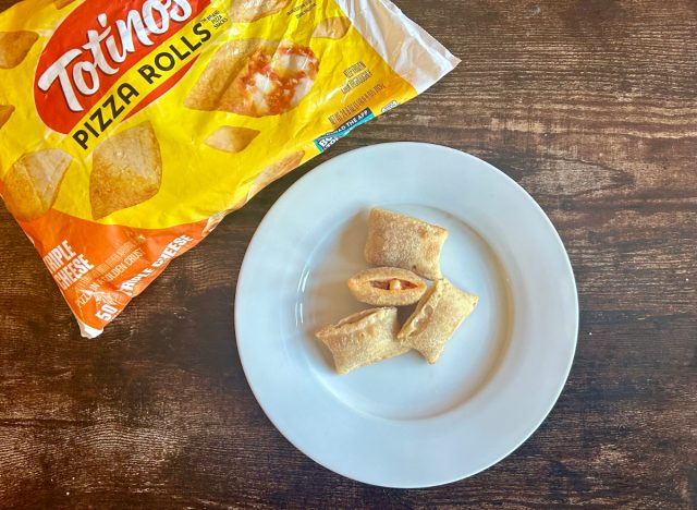 Totino's Triple Cheese Pizza Rolls on a plate next to a bag of the product