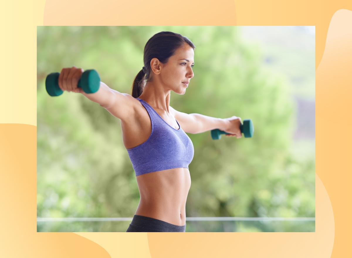 fit woman doing arm raises with dumbbells