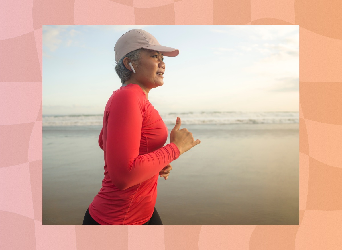 middle-aged woman running on the beach