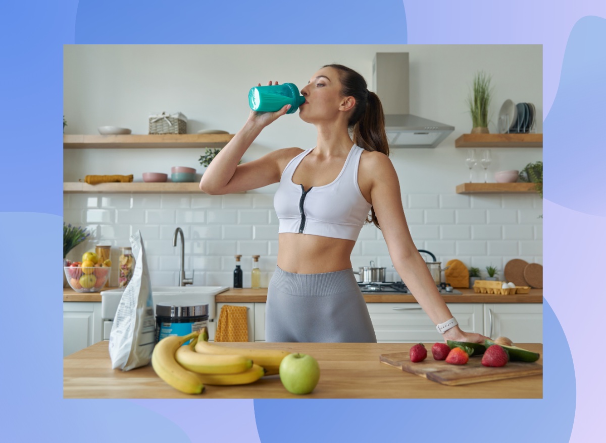 fitness woman drinking a protein shake in bright kitchen