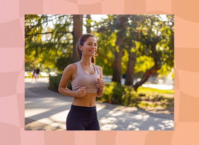 happy brunette woman doing light jogging in a park on a sunny day