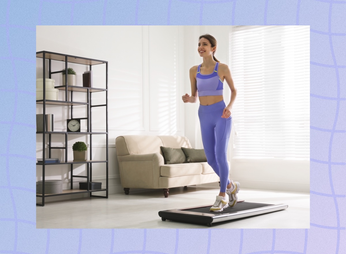 fit woman doing treadmill walking pad workout at home in bright living space