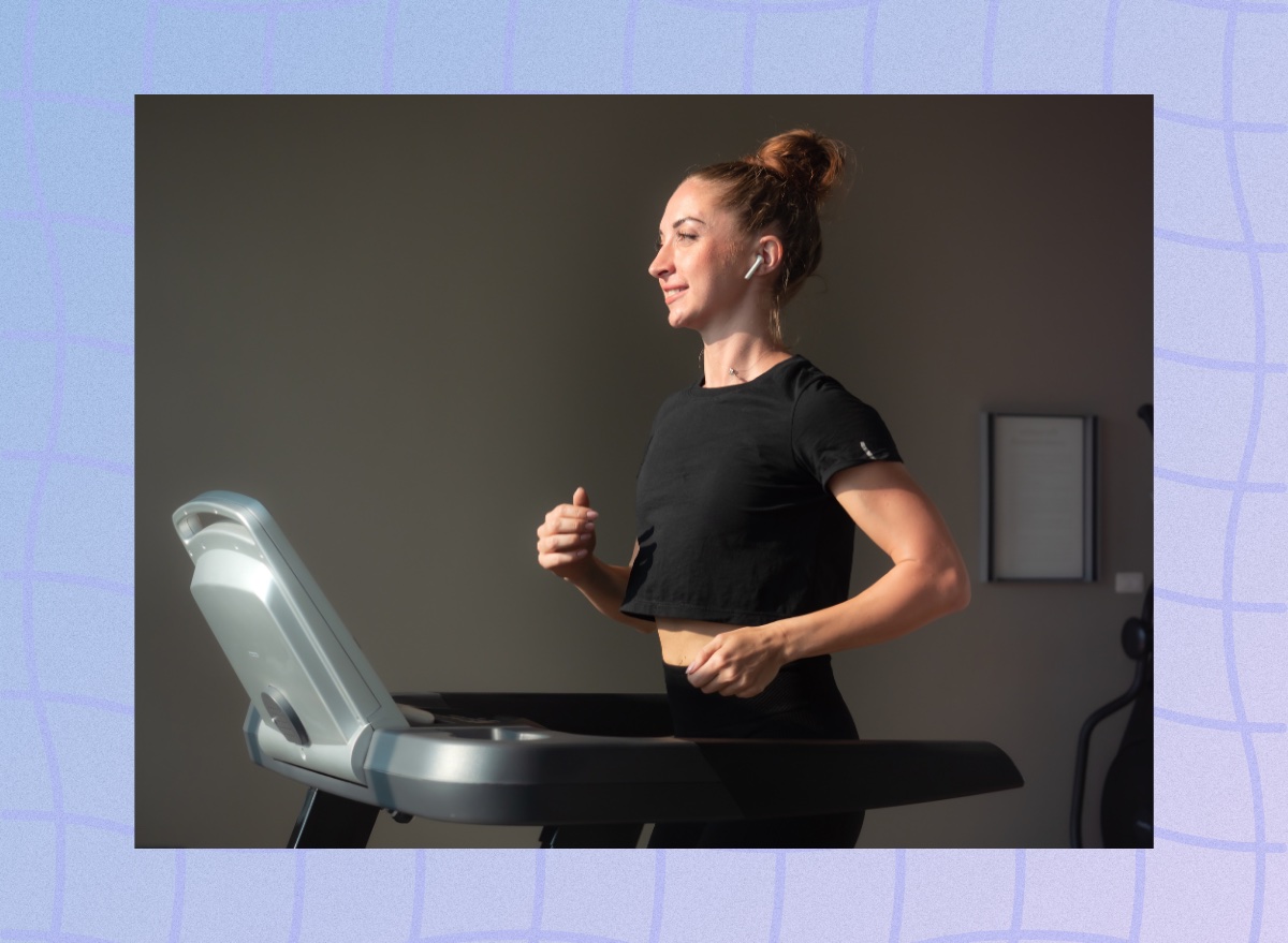 fit, focused brunette woman in black t-shirt and leggings walking on treadmill