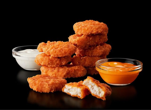 McDonald's Spicy Chicken McNuggets and sauces on black background