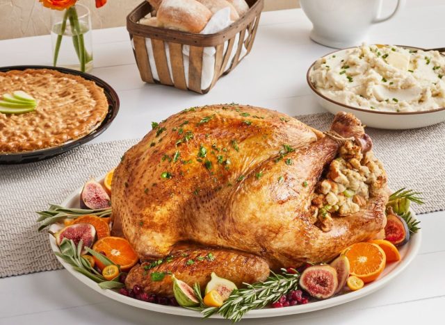 Meijer turkey with other Thanksgiving foods on table