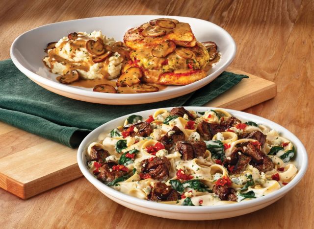 plates of Olive Garden's Steak Gorgonzola Alfredo and Stuffed Chicken Marsala on table