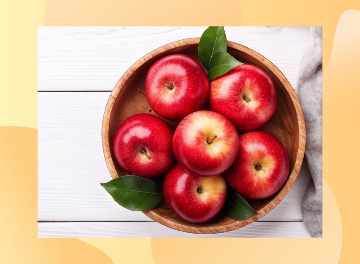 bowl of red apples on white wood table