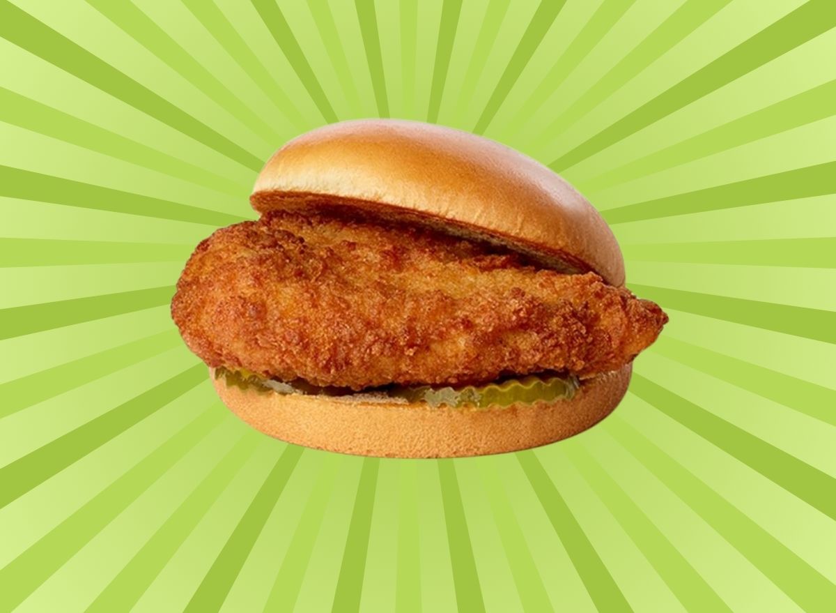 Chick-fil-A fried chicken sandwich on a graphic green background