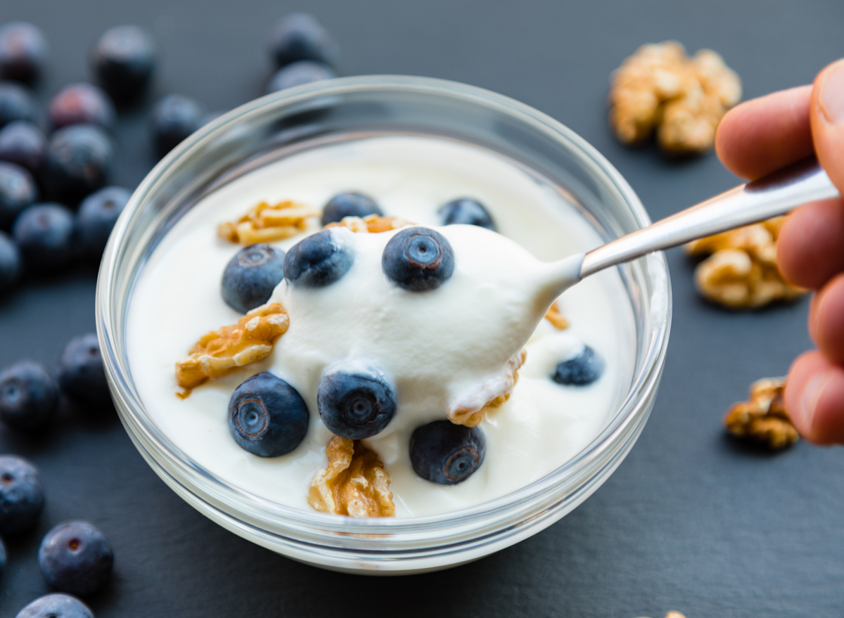 Plain full-fat yogurt (Greek Yogurt) on slate background.