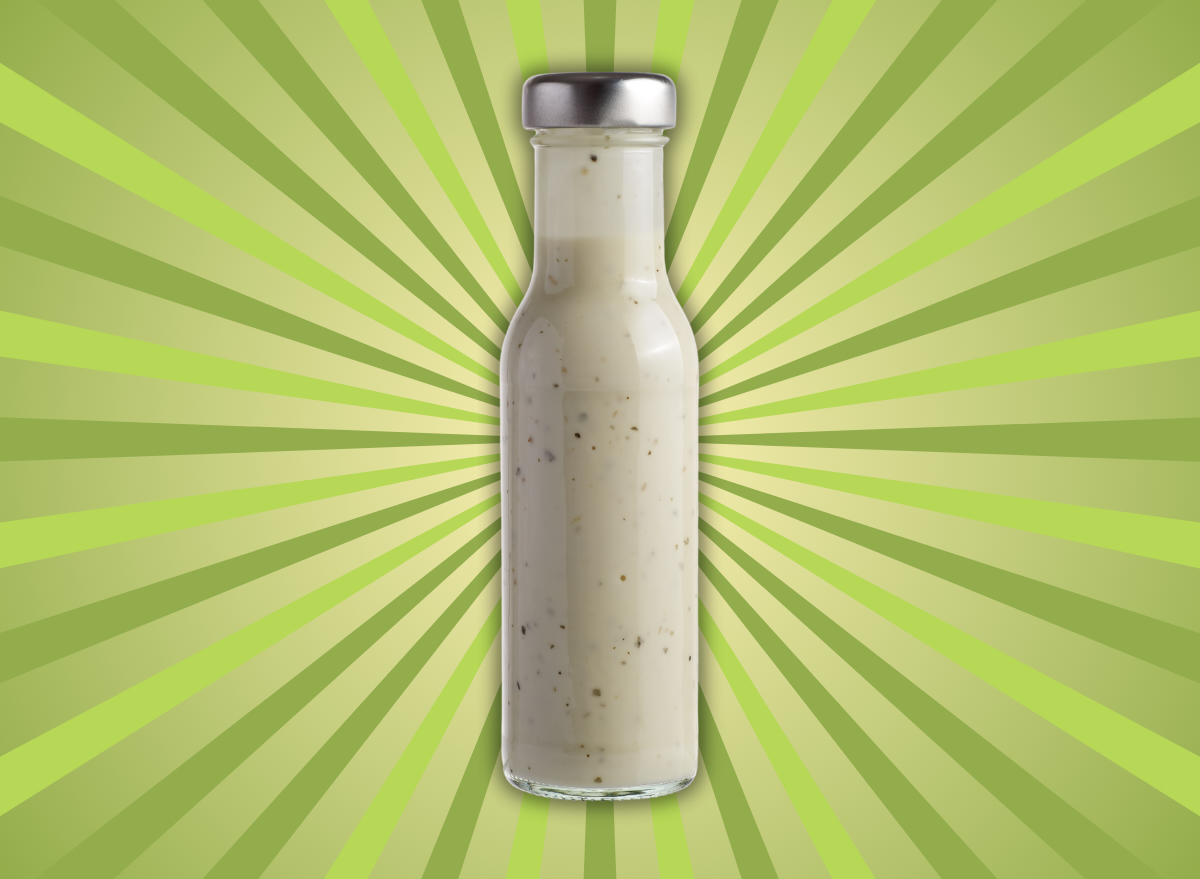 high fat salad dressing depicted by bottled salad dressing isolated on a green burst background