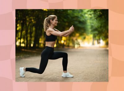 middle-aged blonde woman doing jump lunge or walking lunge exercise outdoors in park