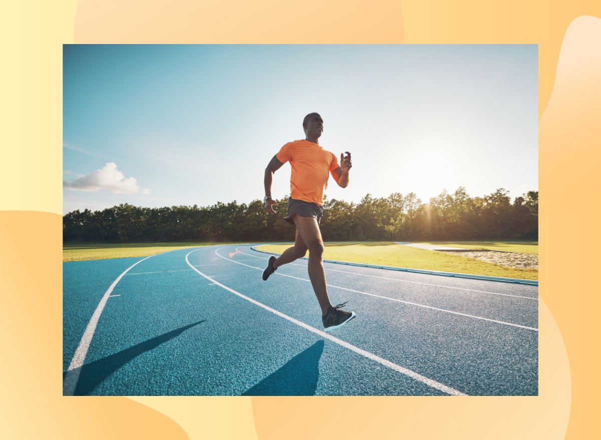 fit, athletic man spring on track on sunny day