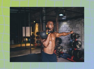 fit, shirtless man doing kettlebell exercises in dark gym setting