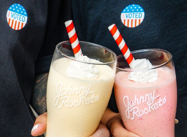 people holding Johnny Rockets' milkshakes and wearing "I Voted" stickers