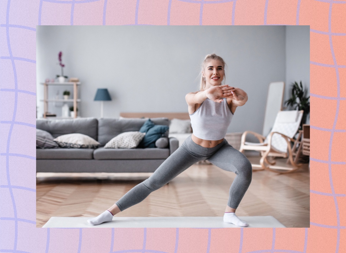 woman doing side lunge in bright apartment living space