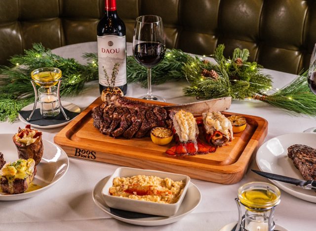 sullivan's steakhouse holiday dishes and a glass of wine on a table