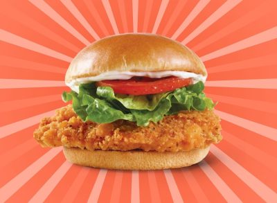 Wendy's Spicy Chicken Sandwich set against a designed red background